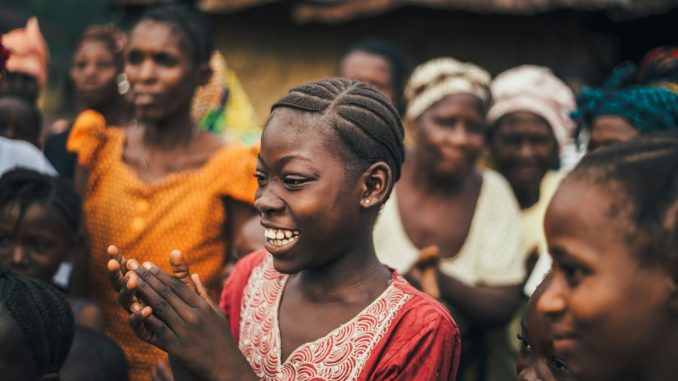 Photo by Annie Spratt woman looking at the ground while smiling