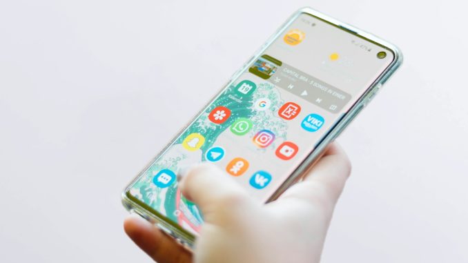 Photo by Christian Wiediger person using silver Android smartphone