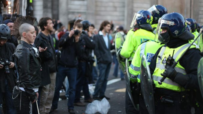 Photo by Jonathan Harrison people and security on the road