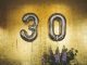 minimalist photography of hanged 30 balloons