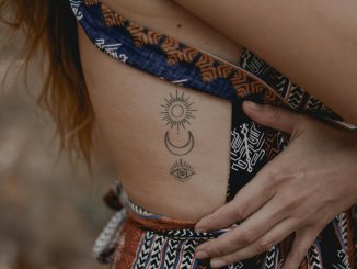 woman with floral tattoo on her right arm