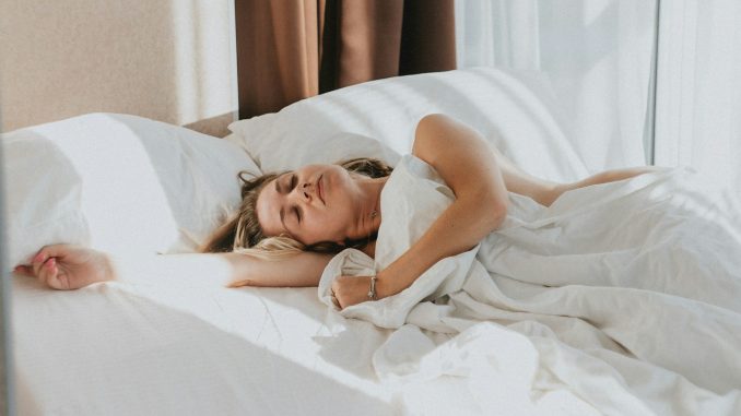 a person lying in a bed